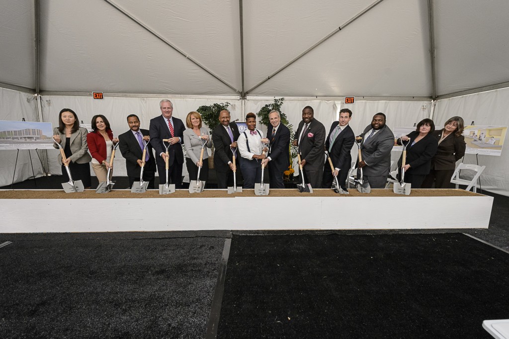 Officials with shovels join in ground-breaking ceremony.